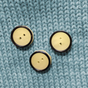 Knapp svart och citrongul